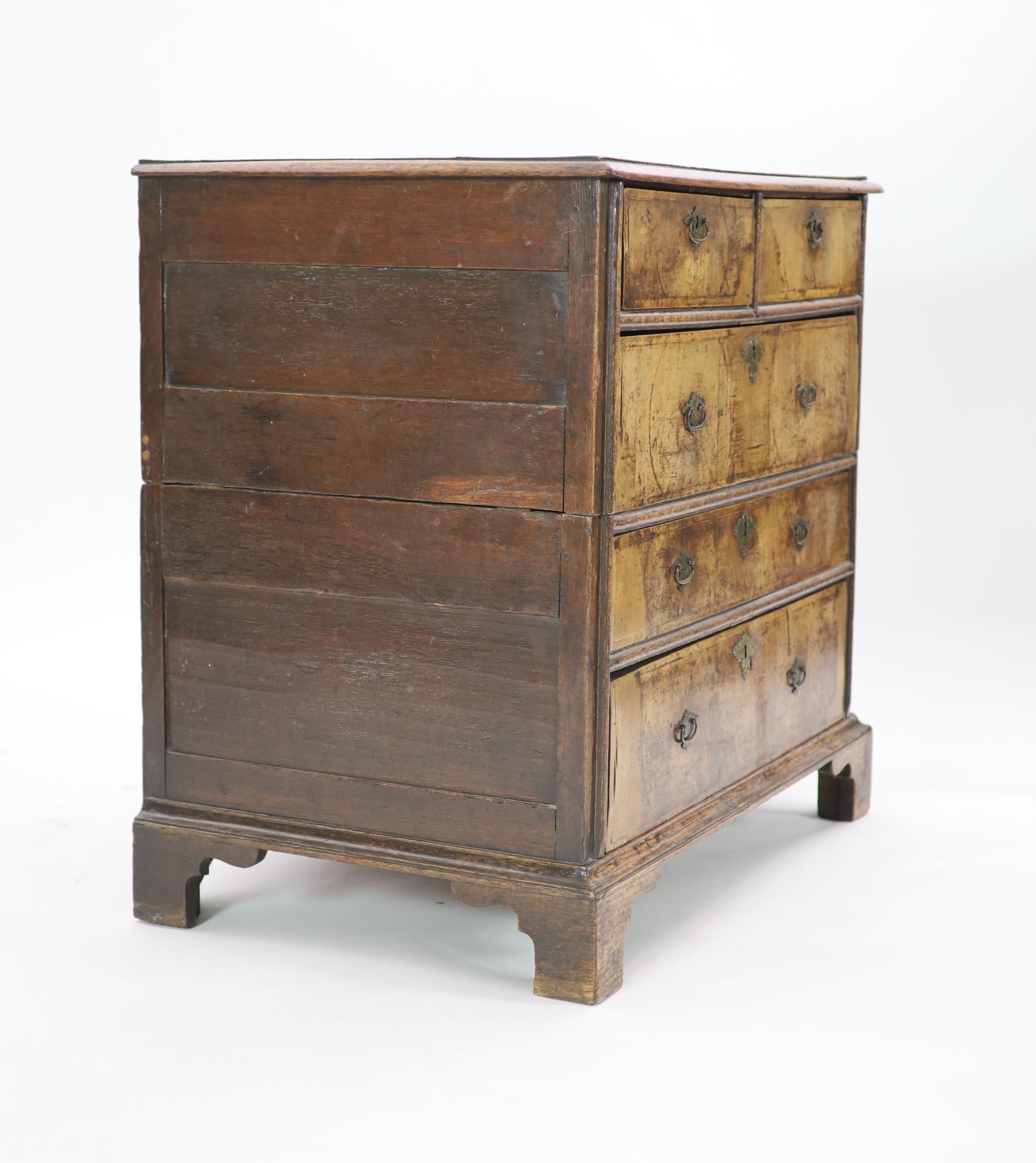 An early 18th century oak and walnut chest, W.94cm D.61cm H.91cm